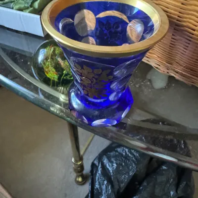 Sale Photo Thumbnail #54: Vintage cobalt blue cut-to-clear crystal vase featuring hand-painted gilt floral motifs and a wide gold rim.