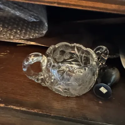 Sale Photo Thumbnail #381: Vintage double-handled clear pressed glass sugar bowl featuring an etched floral and leaf pattern.