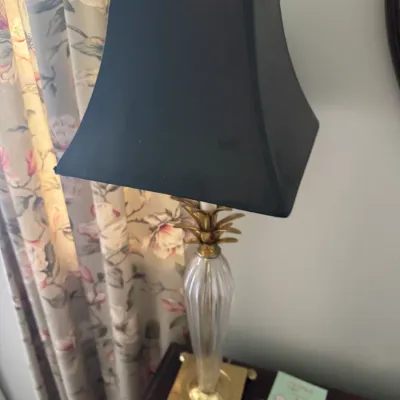 Sale Photo Thumbnail #13: Traditional crystal and brass table lamp with a pineapple accent and a black bell shade.