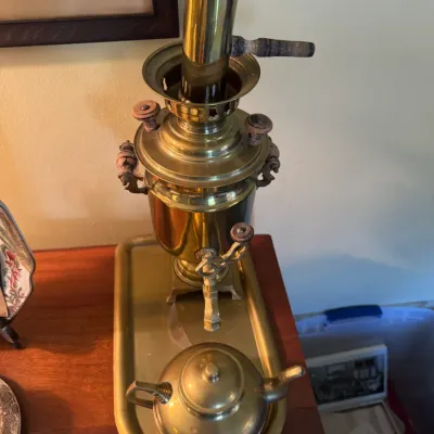 Sale Photo Thumbnail #341: Vintage polished brass Russian-style samovar tea set, including the urn with chimney, matching teapot, and brass tray.