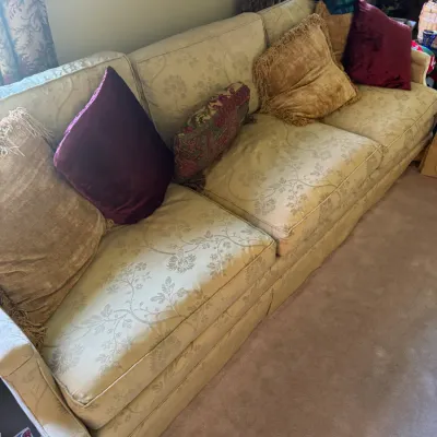 Sale Photo Thumbnail #373: Traditional cream floral jacquard sofa with a kick-pleat skirt and assorted accent pillows.