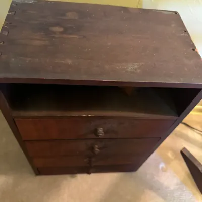 Sale Photo Thumbnail #346: Vintage dark stain wooden mini chest featuring an open top shelf and four small drawers with dovetail construction.