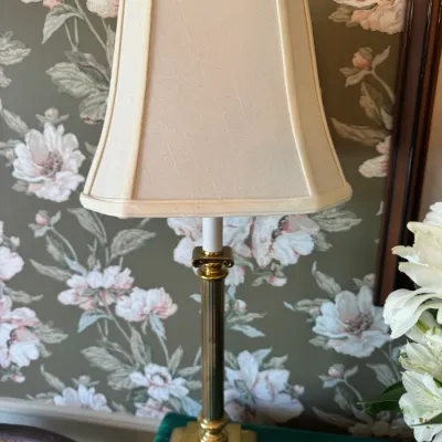 Sale Photo Thumbnail #383: Traditional brass table lamp featuring a fluted column, classical capital, tiered square base, and cream fabric shade.