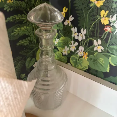 Sale Photo Thumbnail #245: Vintage cut glass decanter featuring a geometric crosshatch pattern, ribbed neck, and matching original stopper.