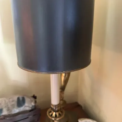 Sale Photo Thumbnail #322: Vintage brass table lamp featuring a faux-candle sleeve, square base, and a tall cylindrical black drum shade.