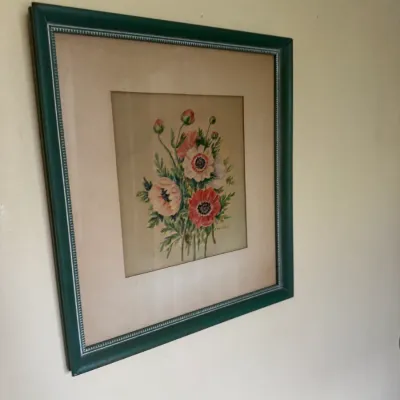 Sale Photo Thumbnail #144: Framed watercolor painting featuring a bouquet of pink and red anemone flowers, housed in a double-matted dark green frame with beaded inner detail.