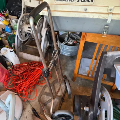 Sale Photo Thumbnail #199: Vintage Sears X-Cargo car top carrier positioned above a folding metal hand truck and various garage items.