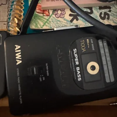 Sale Photo Thumbnail #181: Vintage Aiwa T100A Super Bass stereo radio cassette player in black casing.