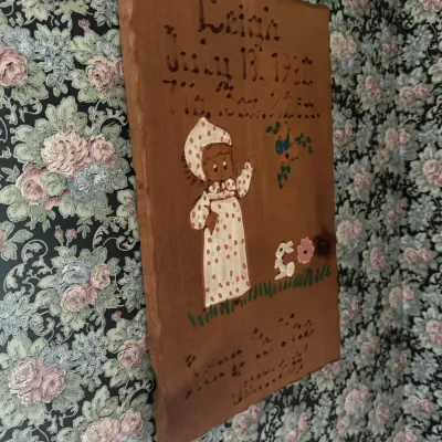 Sale Photo Thumbnail #131: Hand-painted wooden birth announcement plaque dated July 18, 1980, featuring a child in polka dots, a bunny, and lettering.