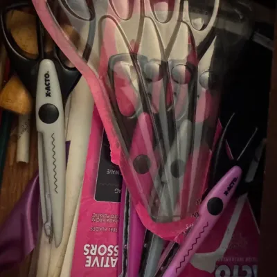 Sale Photo Thumbnail #177: Collection of X-Acto decorative craft scissors and edge trimmers inside a drawer, including both packaged and loose pairs.