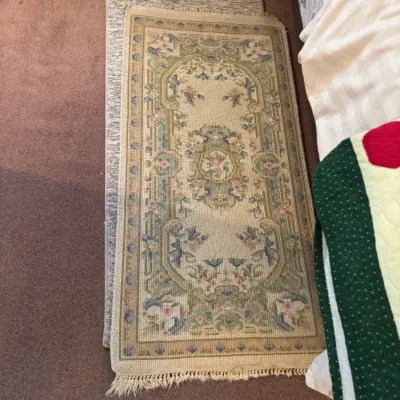 Sale Photo Thumbnail #153: Small oriental-style runner rug with floral medallion pattern in pastel green, cream, and pink tones.