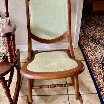 Sale Photo Thumbnail #220: Wooden rocking chair with upholstered seat and back