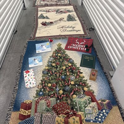 Sale Photo Thumbnail #170: 11 piece Christmas set for throw blankets one new hand towel three books one reindeer ornament one merry Christmas bag one wine stopper. All in perfect condition blankets measure approximately. 1 72x57 and 3 at 65x44.