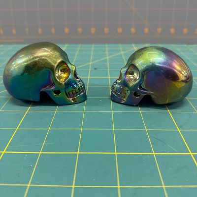 Sale Photo Thumbnail #68: Titanium skulls pair