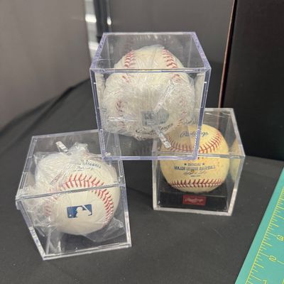 Sale Photo Thumbnail #148: 22 Piece Sports set with mitt, seven baseballs, one plastic ball, three collector balls - signed, one 49ers football - new in the box, 2 hats size large extra-large, five sports illustrated magazines, one Triple Crown one Giants of October book, all in ex