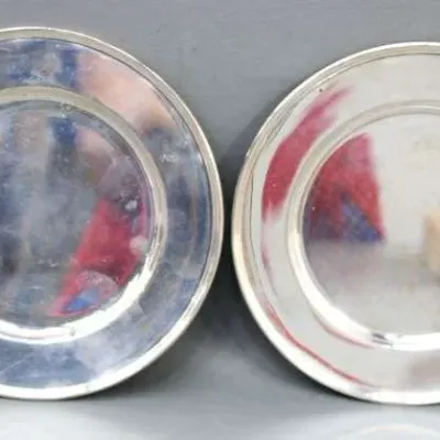 Sale Photo Thumbnail #20: Pair of vintage silver-toned metal bread plates with simple rolled rims.