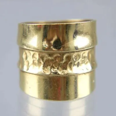 Sale Photo Thumbnail #7: Wide gold-tone cigar band ring with a central hammered texture section and polished borders.