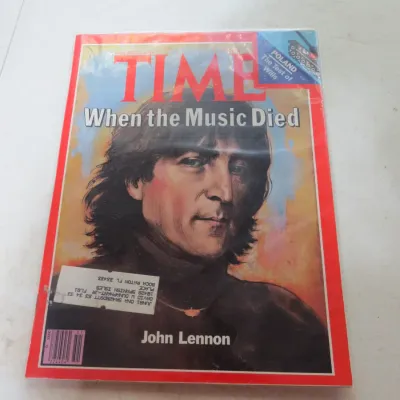Sale Photo Thumbnail #109: December 22, 1980 issue of TIME Magazine featuring John Lennon on the cover, encased in a protective plastic sleeve.
