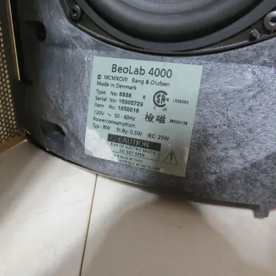 Sale Photo Thumbnail #124: Detail view of the serial and specification label on a Bang & Olufsen BeoLab 4000 speaker, made in Denmark.