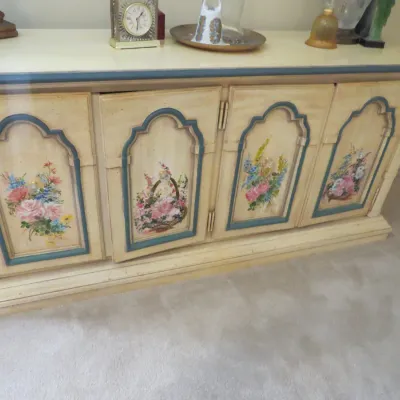 Sale Photo Thumbnail #86: French Provincial style four-door credenza with cream painted finish, blue trim, and hand-painted floral panels.