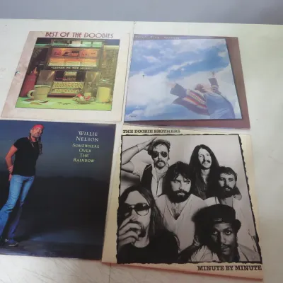 Sale Photo Thumbnail #101: Collection of four vintage vinyl LP albums including The Doobie Brothers, Willie Nelson, and Carole King, circa 1970s–1980s.