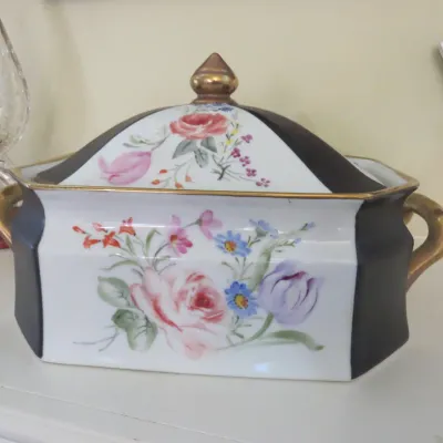 Sale Photo Thumbnail #37: Vintage covered porcelain tureen with hand-painted floral panels, black and gold accent borders, and twin handles.