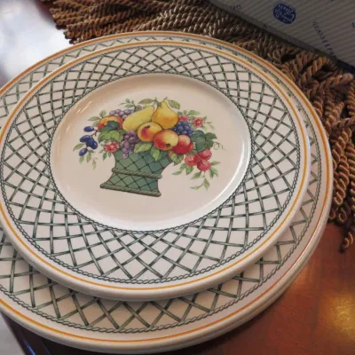 Sale Photo Thumbnail #26: Villeroy & Boch 'Basket' pattern ceramic dinnerware, featuring a green lattice border and central fruit basket motif.