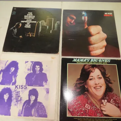 Sale Photo Thumbnail #92: Collection of four vintage vinyl LP albums, including titles by The Dave Brubeck Quartet, Don McLean, Kiss, and Mama Cass Elliot.
