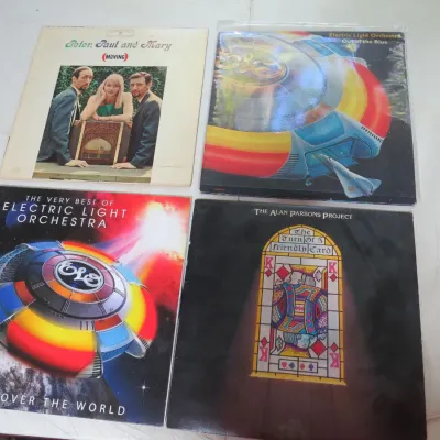 Sale Photo Thumbnail #115: Collection of four vintage classic rock and folk vinyl LP albums, including titles by Peter, Paul and Mary, Electric Light Orchestra, and The Alan Parsons Project.