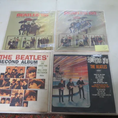 Sale Photo Thumbnail #145: Four vintage Beatles vinyl LP albums in protective sleeves, including 'Beatles '65', 'The Beatles' Second Album', and 'Something New'.