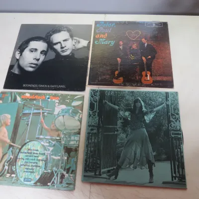Sale Photo Thumbnail #111: Collection of four vintage folk and rock vinyl records, including Simon & Garfunkel's Bookends, Peter, Paul and Mary, Woodstock Two, and Carly Simon's Anticipation.
