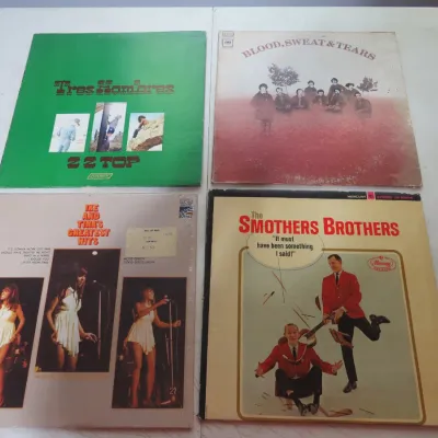 Sale Photo Thumbnail #105: Collection of four vintage 33 RPM vinyl record albums, including ZZ Top's "Tres Hombres," Blood, Sweat & Tears, Ike and Tina's Greatest Hits, and The Smothers Brothers.