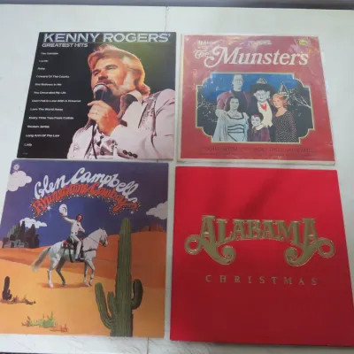 Sale Photo Thumbnail #129: Collection of four vintage vinyl LP albums, including Kenny Rogers' Greatest Hits, At Home with The Munsters, Glen Campbell's Rhinestone Cowboy, and Alabama Christmas.