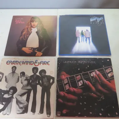 Sale Photo Thumbnail #104: Group of four vintage vinyl LP albums including Juice Newton's Quiet Lies, The Moody Blues' Octave, Earth, Wind & Fire's That's the Way of the World, and Willie Hutch's Ode to My Lady.