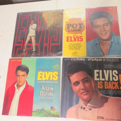 Sale Photo Thumbnail #142: Collection of four vintage Elvis Presley vinyl LP records, including 'Kissin' Cousins', 'Pot Luck', 'Elvis Is Back!', and the NBC-TV special album, all in protective plastic sleeves.