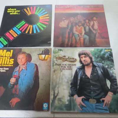 Sale Photo Thumbnail #130: Collection of four vintage vinyl country and pop LP albums, including titles by Mel Tillis, Waylon Jennings, and The Charlie Daniels Band.