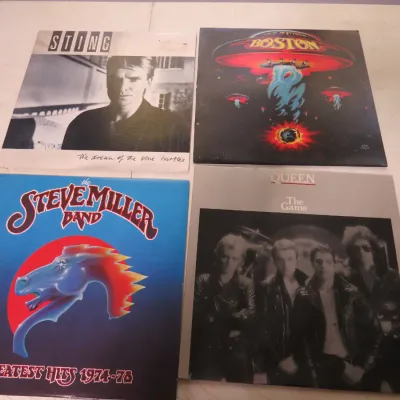 Sale Photo Thumbnail #127: Collection of four vintage rock vinyl LP albums including Sting's 'The Dream of the Blue Turtles', Boston's self-titled debut, Steve Miller Band 'Greatest Hits 1974-78', and Queen's 'The Game'.