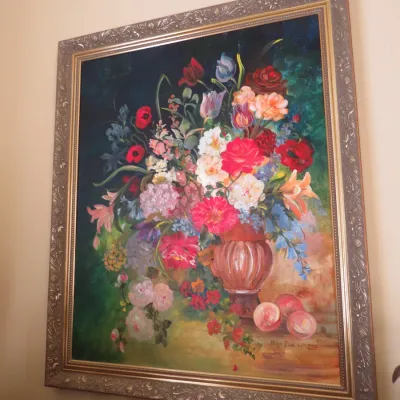 Sale Photo Thumbnail #14: Large framed still life oil painting depicting an abundant bouquet of colorful flowers in a vase, housed in an ornate silver and gold-tone molded frame.