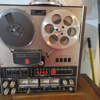 Sale Photo Thumbnail #97: Vintage Dokorder reel-to-reel tape deck with silver take-up reel and VU meters, circa 1970s.