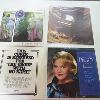 Sale Photo Thumbnail #95: Group of four vintage vinyl LP record albums, including titles by Judy Collins, Jerry Lee Lewis, Peggy Lee, and a promotional jacket for 'The Group With No Name'.