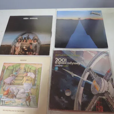 Sale Photo Thumbnail #112: Group of four vintage vinyl LP record albums, including ABBA's Arrival, Judas Priest's Point of Entry, Genesis' Selling England by the Pound, and the 2001: A Space Odyssey soundtrack.