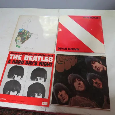 Sale Photo Thumbnail #113: Collection of four vintage vinyl LP albums, including The Beatles' Rubber Soul and A Hard Day's Night soundtrack, Van Halen's Diver Down, and Joni Mitchell's Court and Spark.