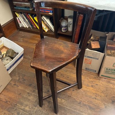 Sale Photo Thumbnail #8: Vintage dark wood three-legged corner chair with a triangular seat and curved backrest, showing light surface wear.