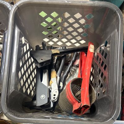 Sale Photo Thumbnail #82: Plastic crate filled with assorted hand tools, including a red metal potato ricer and staple guns.