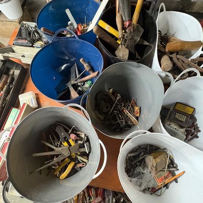 Sale Photo Thumbnail #72: Assorted vintage hand tools, hardware, and fasteners organized in colorful plastic tubs and pails.