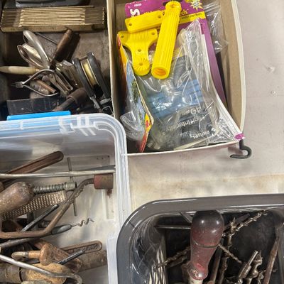 Sale Photo Thumbnail #80: Assorted vintage hand tools, hardware, and household items organized in various bins and cardboard boxes.
