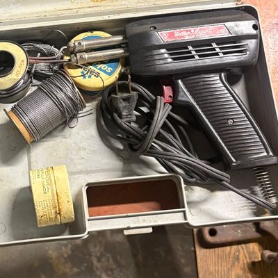 Sale Photo Thumbnail #64: Vintage Weller Expert soldering gun kit in its original plastic carrying case, complete with spools of solder and flux tins.