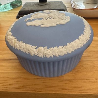 Sale Photo Thumbnail #2: Vintage Wedgwood blue Jasperware covered trinket box featuring white bas-relief classical motifs along the lid and border.