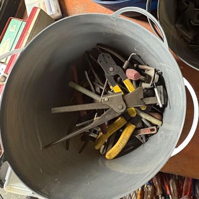 Sale Photo Thumbnail #71: Metal tub filled with assorted vintage hand tools, including wire strippers, pliers, and calipers.