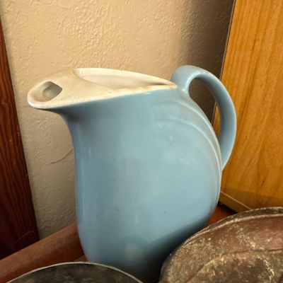 Sale Photo Thumbnail #4: Vintage light blue ceramic ice-lip pitcher, mid-century style with minor surface wear along the rim.